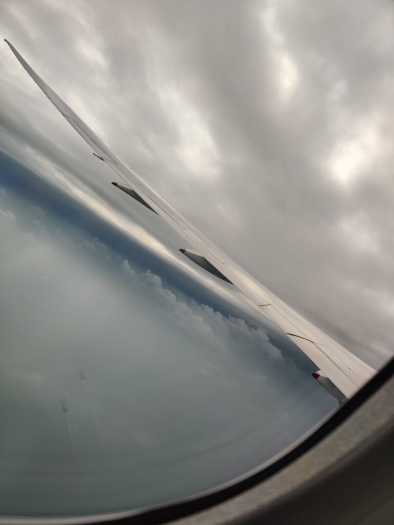 Singapore airline plane hovering over the cloud to bali, indonesia