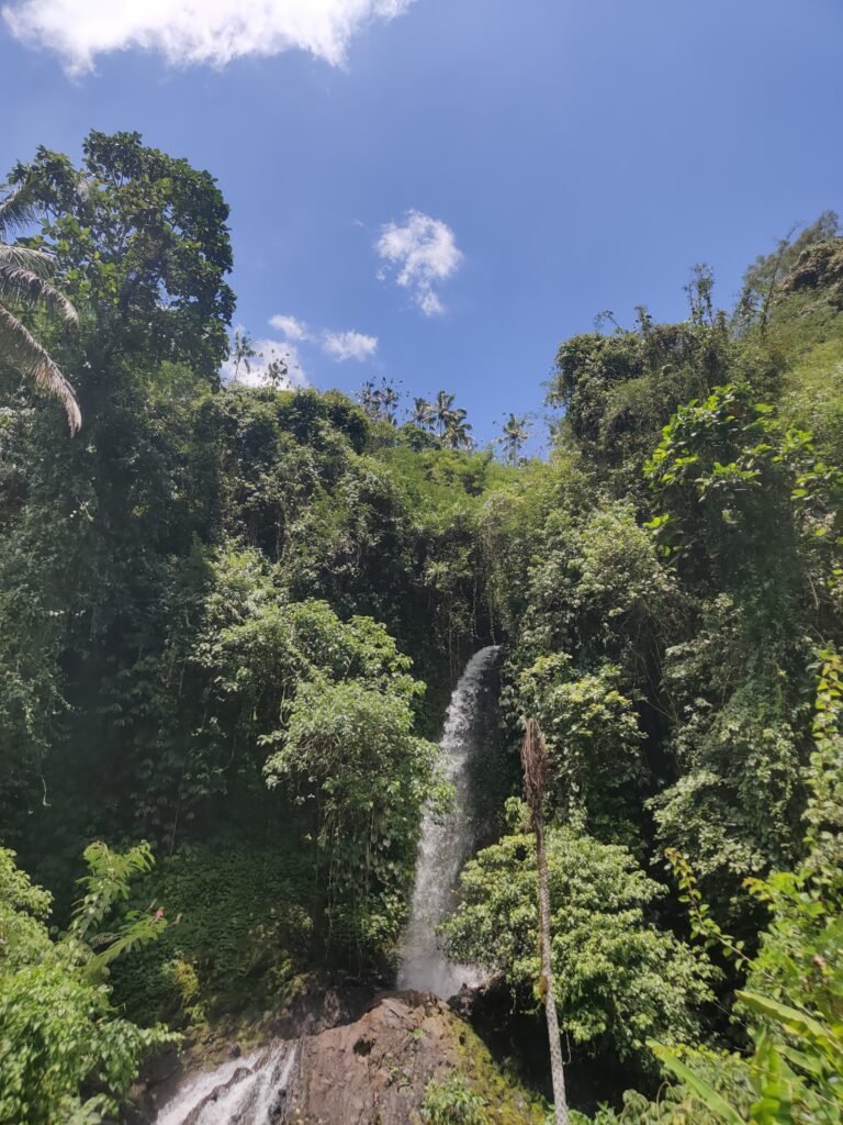 beautiful waterfall in the middle of water rafting in bali indonesia