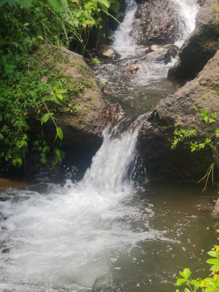 beautiful waterfall in the middle of water rafting in bali indonesia