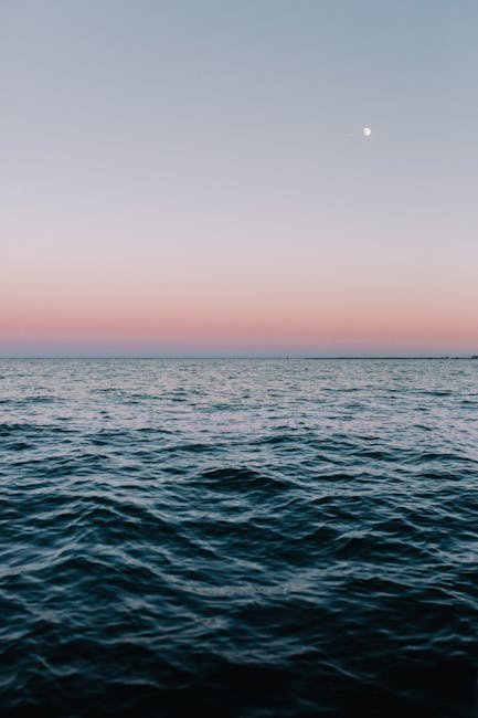 Tranquil twilight sea view in Norfolk, VA, with calming waves and pastel sky hues.